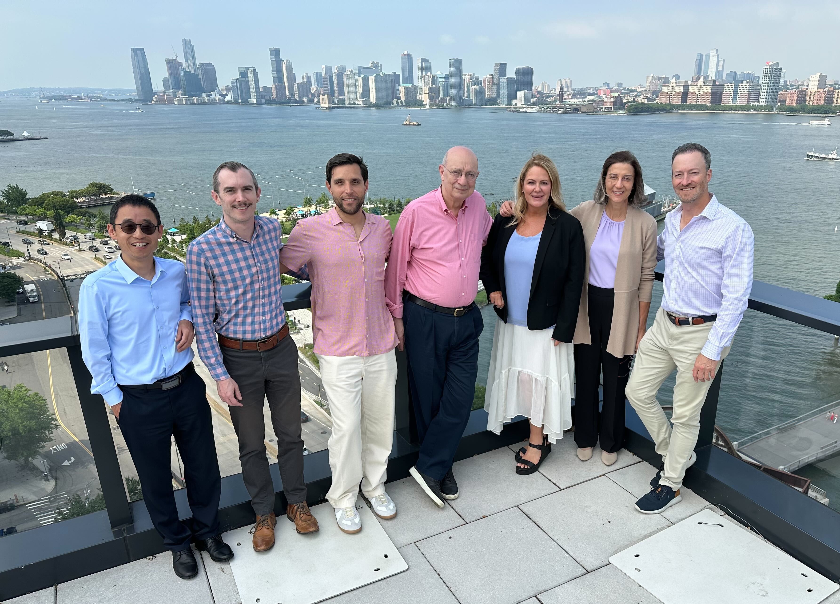 Prolium team group photo with skyline